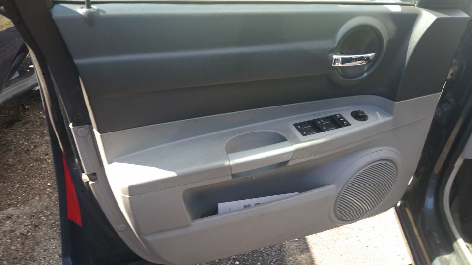 Driver door panel interior of a Dodge Charger