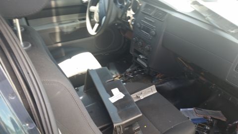 2001 Ford Crown Victoria - Photo of a Dodge Charger interior with the center stack and dashboard partially disassembled.