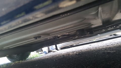 2001 Ford Crown Victoria - Photo of the underside of a vehicle showing rocker panel and frame structure.