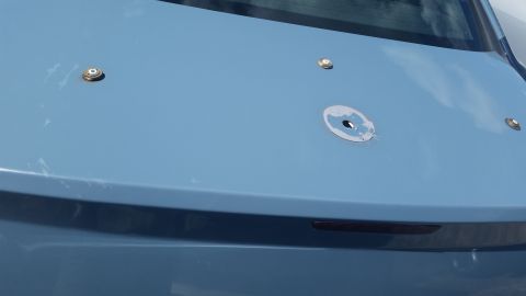2001 Ford Crown Victoria - Photo of a light blue vehicle decklid panel with mounting holes, not a technical document.