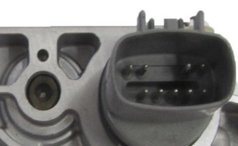 1994 Ford Bronco - Photograph of an electrical connector on an automotive part, not a diagram.