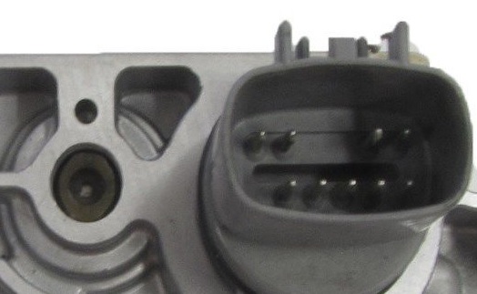 Close-up photo of a multi-pin electrical connector on a part