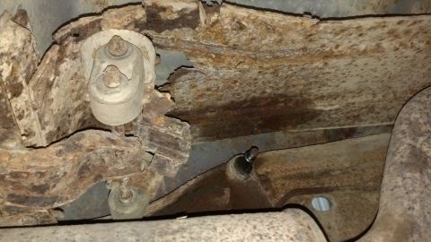 1996 Ford Bronco - Muffler bracket is completely rusted away.