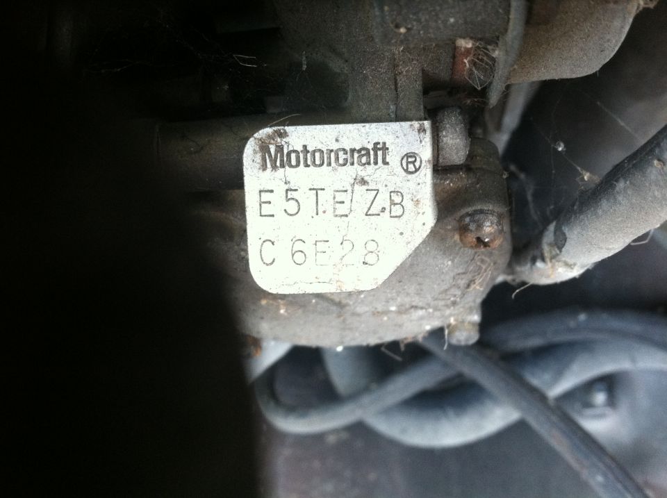 Motorcraft label with part numbers E5TEZB C6E28 on a vehicle component.