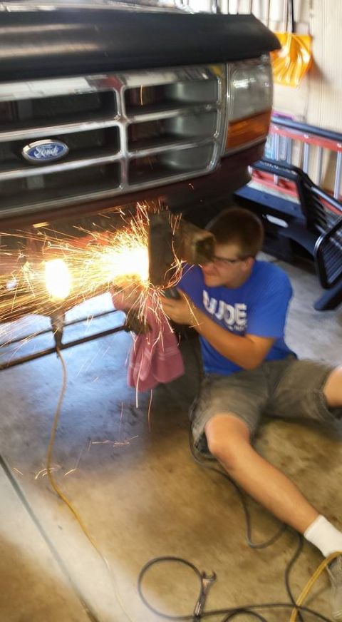 1996 Ford Bronco - Stubborn bolts are no problem for my son and a grinder.