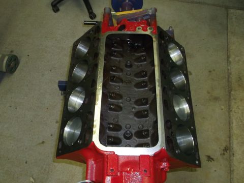 1957 Ford Custom Sedan - Engine block with cylinder bores and gasket visible, likely undergoing rebuild or repair.