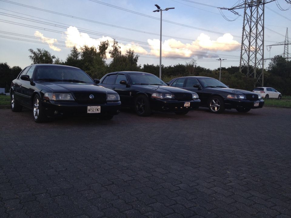 Three black 2003 Mercury Marauders parked in a lot