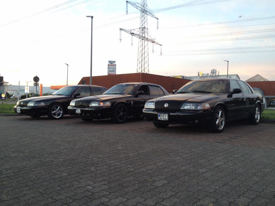 Three black 2003 Mercury Marauders parked side-by-side