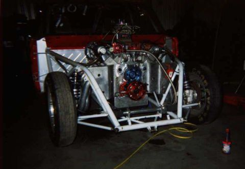 1963 Ford Fairlane - Custom drag car chassis with engine and front suspension visible.