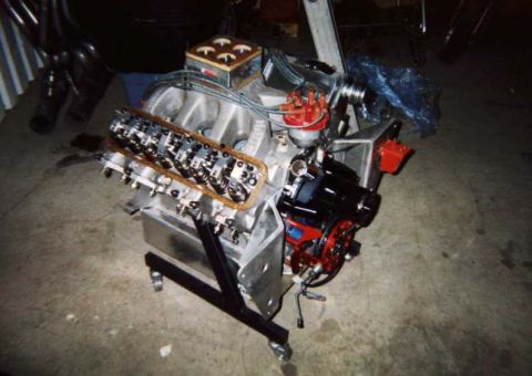 1963 Ford Fairlane - Engine assembly on a stand, with the intake manifold removed to expose the valve train components.