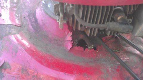 2006 Honda RANCHER - Rusted lawn mower deck with engine visible, showing significant wear and tear.
