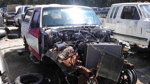 1994 Ford Bronco - This Ford Bronco is in a junkyard, missing its front end and engine components.