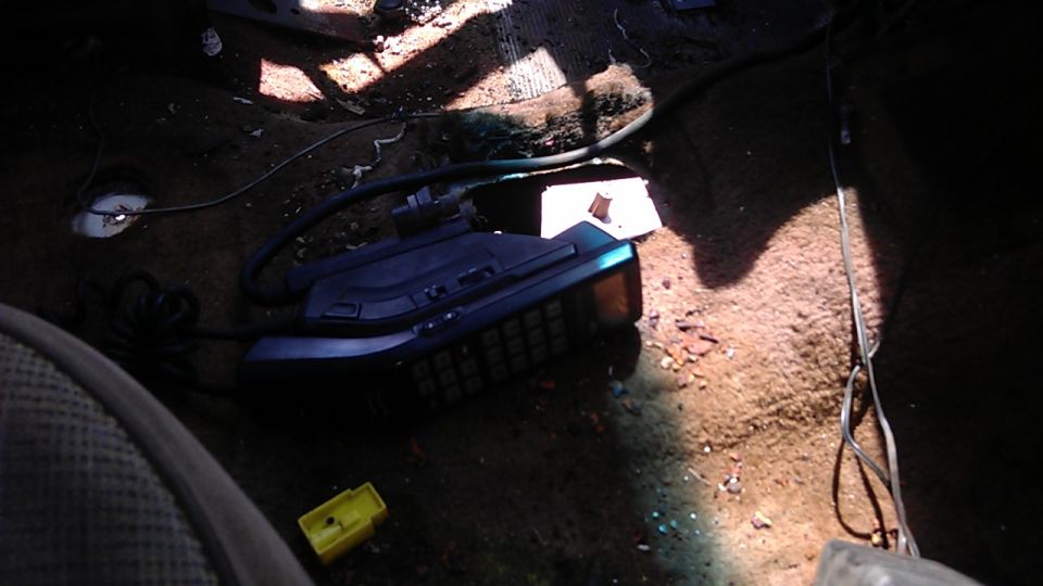Interior view of a car with a car phone on the floor