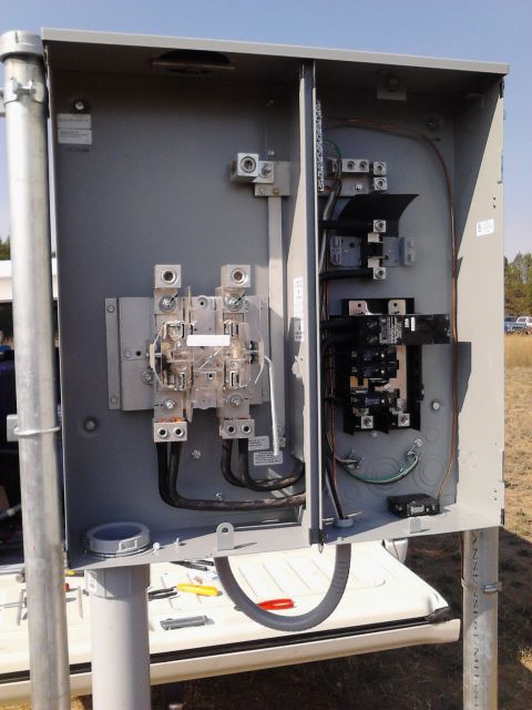 1989 Ford Bronco - An open electrical panel shows complex wiring and circuit breakers, suggesting a power setup.