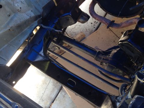 1978 Ford Bronco - Close-up view of the engine bay, showing various mechanical components and the exhaust system.