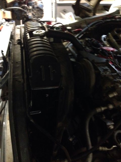1978 Ford Bronco - Close-up view of a vehicle's engine bay, showing the radiator and various engine components.