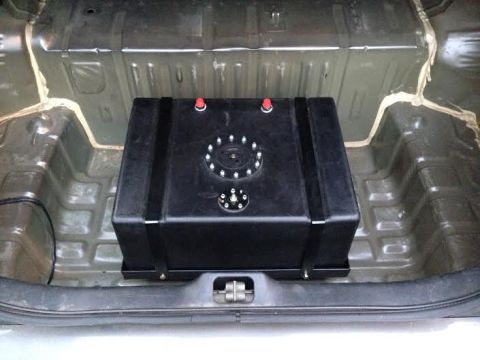 2004 Ford Crown Victoria - A large aftermarket fuel cell is installed in the trunk of a vehicle.