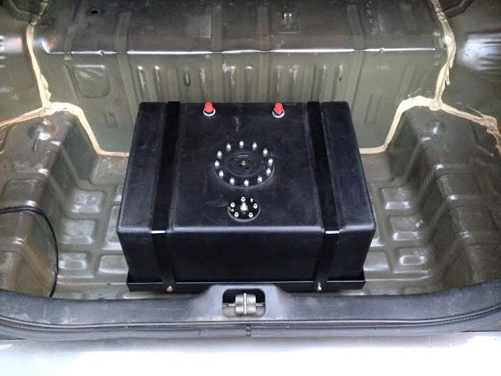Trunk interior with a large black fuel cell installed