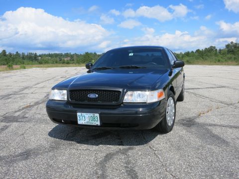2001 Ford Crown Victoria - Front view of a black 2001 Ford Crown Victoria police car.