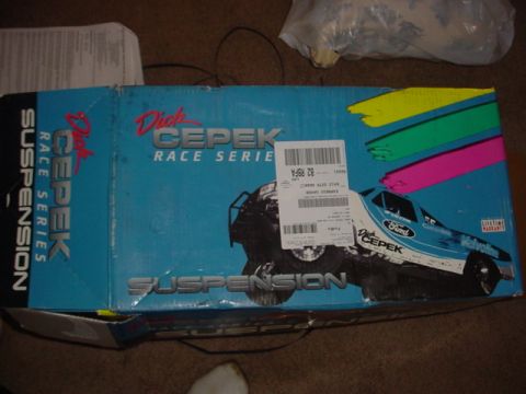 1988 Ford Bronco - A box for Dick Cepek suspension parts is shown with graphics of off-road and race trucks.