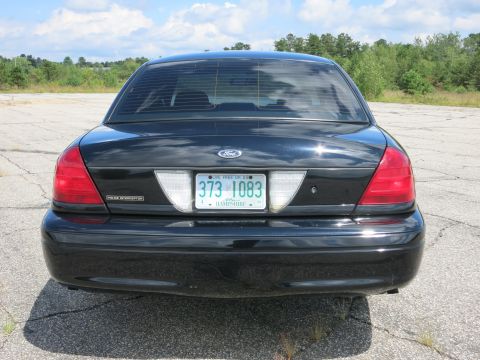 2001 Ford Crown Victoria - Rear view of a black 2001 Ford Crown Victoria Police Interceptor showing its license plate.