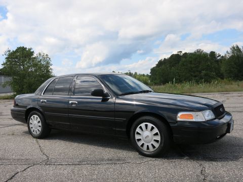 2001 Ford Crown Victoria - This 2001 Ford Crown Victoria is seen from a 3/4 front angle on a paved lot.