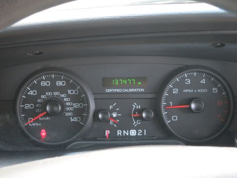 2001 Ford Crown Victoria - The dashboard displays the odometer reading and tachometer, indicating a vehicle interior.