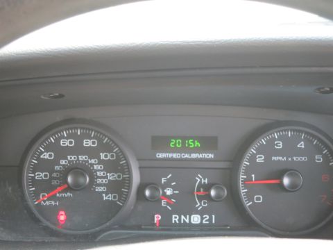 2001 Ford Crown Victoria - Dashboard gauges including speedometer, tachometer, and fuel level indicator are visible.