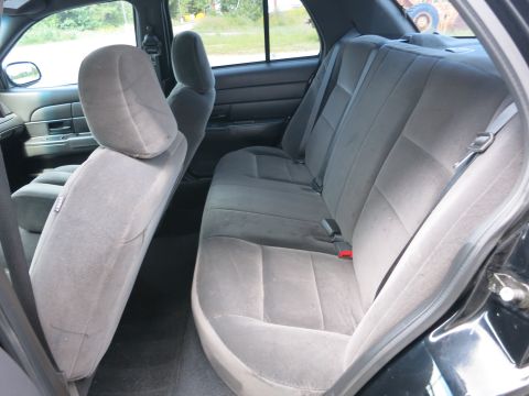 2001 Ford Crown Victoria - Interior view of a 2001 Ford Crown Victoria, highlighting the gray cloth seating and interior trim.