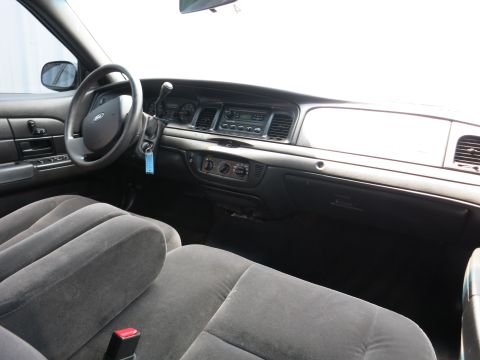 2001 Ford Crown Victoria - Interior view of a 2001 Ford Crown Victoria, showing the dashboard and front seats.