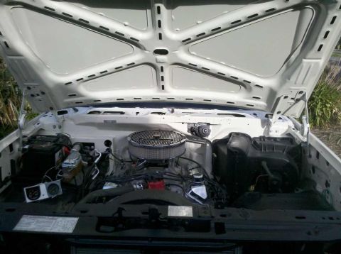 1982 Ford Bronco - Engine bay of a 1982 Ford Bronco, showing the V8 engine and components under the hood.