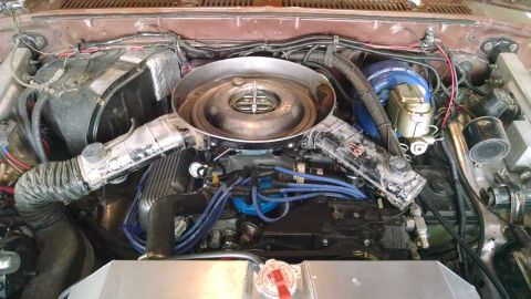 1979 Ford F-150 - A close-up view of a vehicle's engine bay, showing various components and wiring.