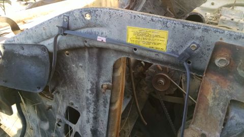 1979 Ford F-150 - Close-up of engine bay components, including a yellow warning sticker and a pulley system.