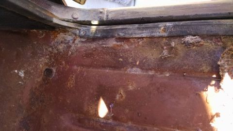1979 Ford F-150 - The floor of this vehicle shows significant rust damage and wear.