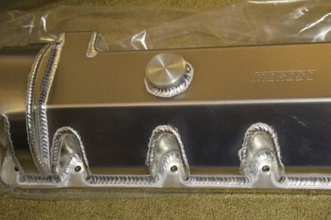 2003 Ford Crown Victoria - Detail of a fabricated aluminum valve cover showing decorative rope welds around the bolt bosses and a center filler cap.