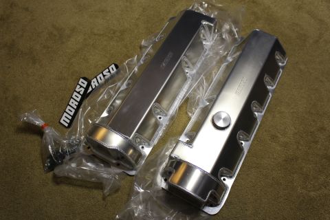 2003 Ford Crown Victoria - Two polished fabricated aluminum valve covers in plastic wrap, with a hardware bag and black Moroso badges alongside.
