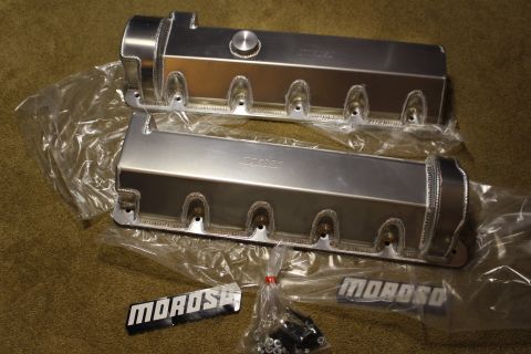 2003 Ford Crown Victoria - Two fabricated aluminum valve covers with rope welds, one with a filler cap, beside mounting hardware and MOROSO badges.
