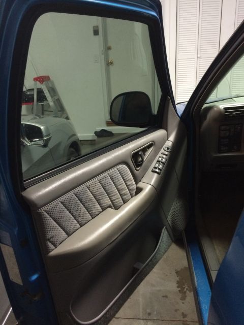 1995 Chevrolet Blazer - Interior view of the driver's side door panel on a 1995 Chevrolet Blazer.