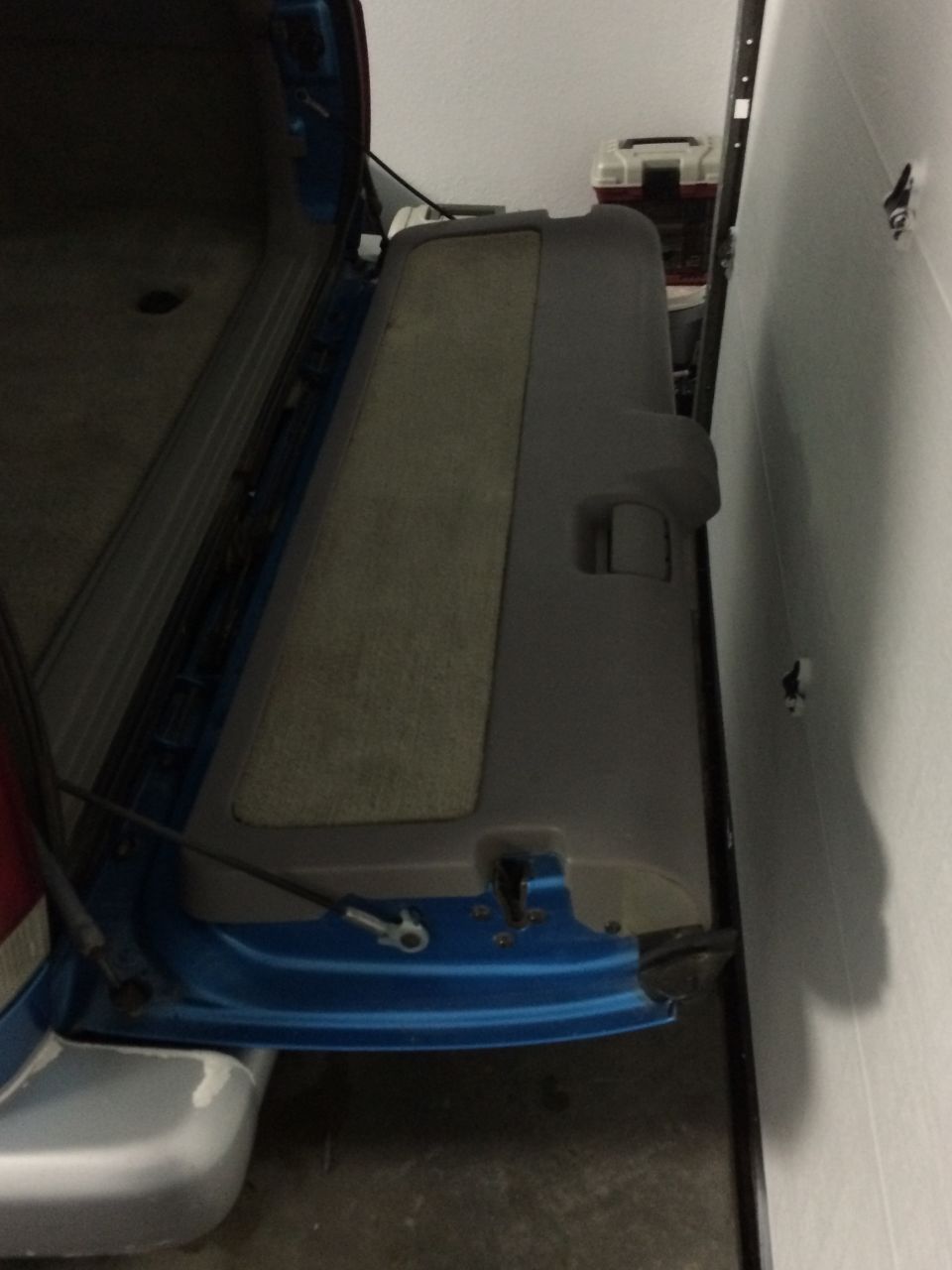 Vehicle's open rear cargo door and interior trim panel