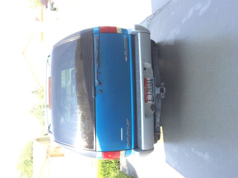 1995 Chevrolet Blazer - Rear view of a blue 1995 Chevrolet Blazer SUV with a silver bumper and an Idaho license plate.