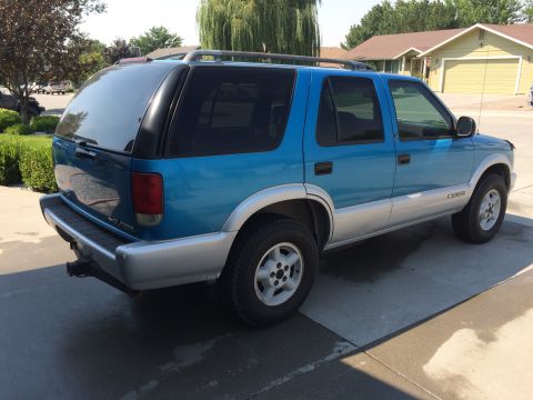 1995 Chevrolet Blazer - This 1995 Chevrolet Blazer is seen from a three-quarter front view, parked on a concrete driveway.