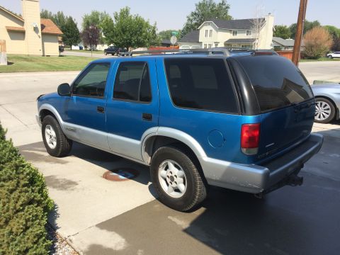 1995 Chevrolet Blazer - This SUV has a two-tone paint scheme with a blue upper body and silver lower body panels.