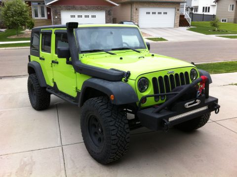 2013 Jeep Wrangler - This modified Jeep Wrangler features a snorkel for water crossings and a winch for recovery.