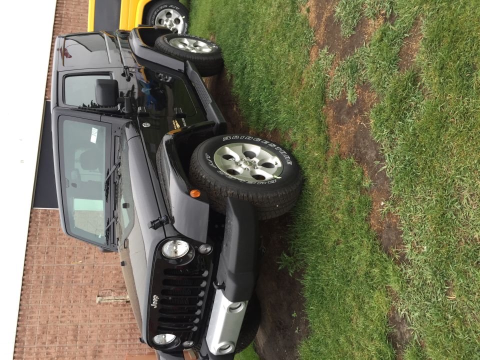 Black 2013 Jeep Wrangler 3/4 front view