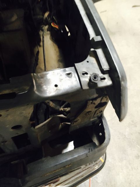 1988 Ford Bronco - This image shows the front fender and frame of a vehicle, likely during a repair or restoration process.