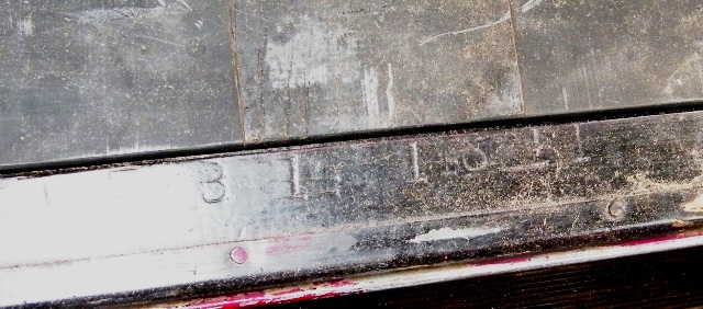 Part with "1914" stamped on it