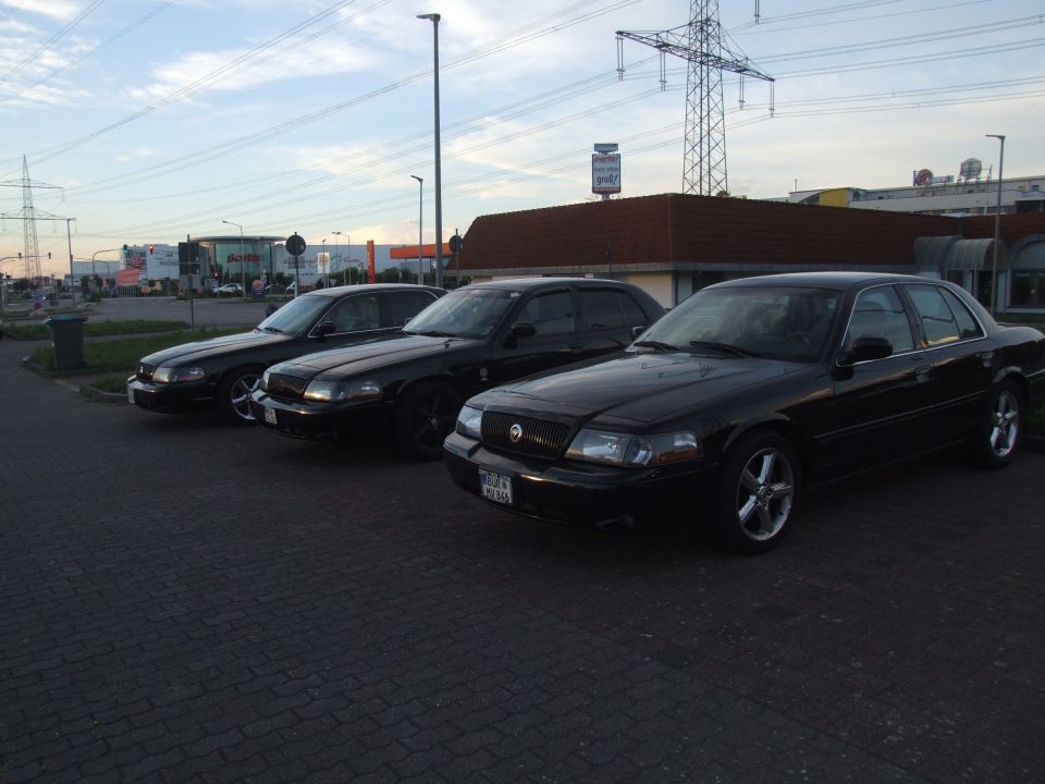 Three black 2003 Mercury Marauders parked side-by-side