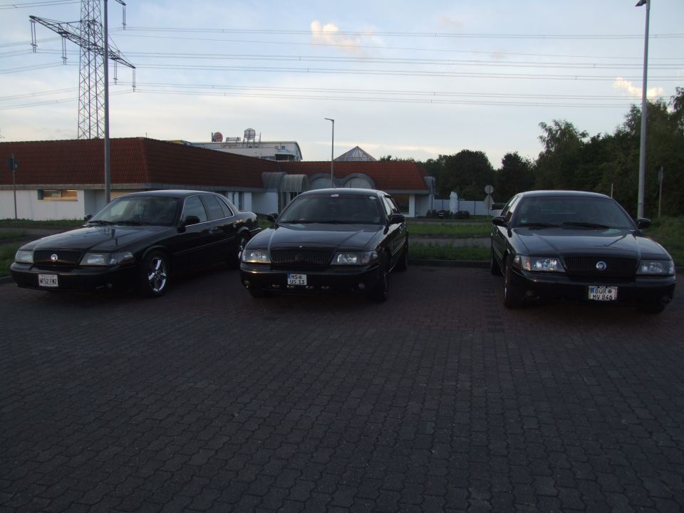 Three black 2003 Mercury Marauders parked in a lot