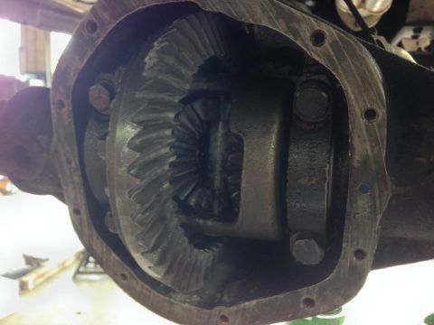 1979 Ford Bronco - Differential gears are visible within the housing of a vehicle's drivetrain.