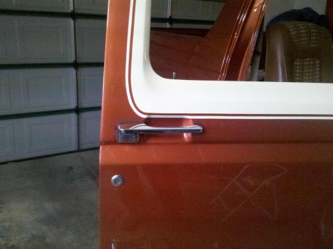 1982 Ford Bronco - Close-up of the side door and window trim on a 1982 Ford Bronco.